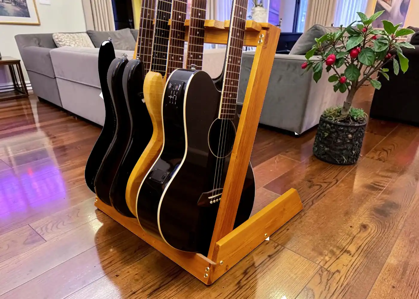 Handmade solid wood multi-guitar rack stand holding four guitars, made by SampWoodworks Berkshire UK